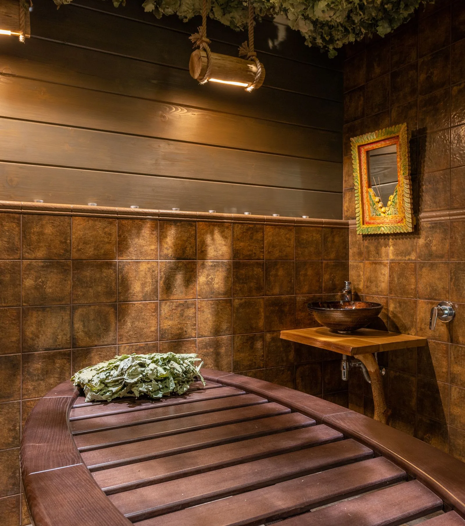 The Aurelia relaxation lounge with warm timber, linen seating and soft candlelight