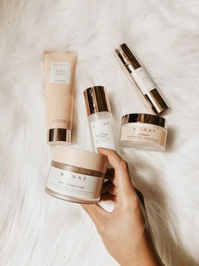 Skincare products on a stone surface