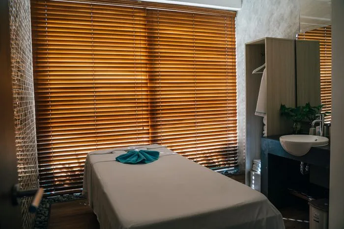 Neutral-toned spa treatment suite with soft daylight